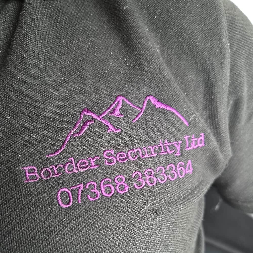 The Border Security Ltd logo embroidered on a security officer's uniform