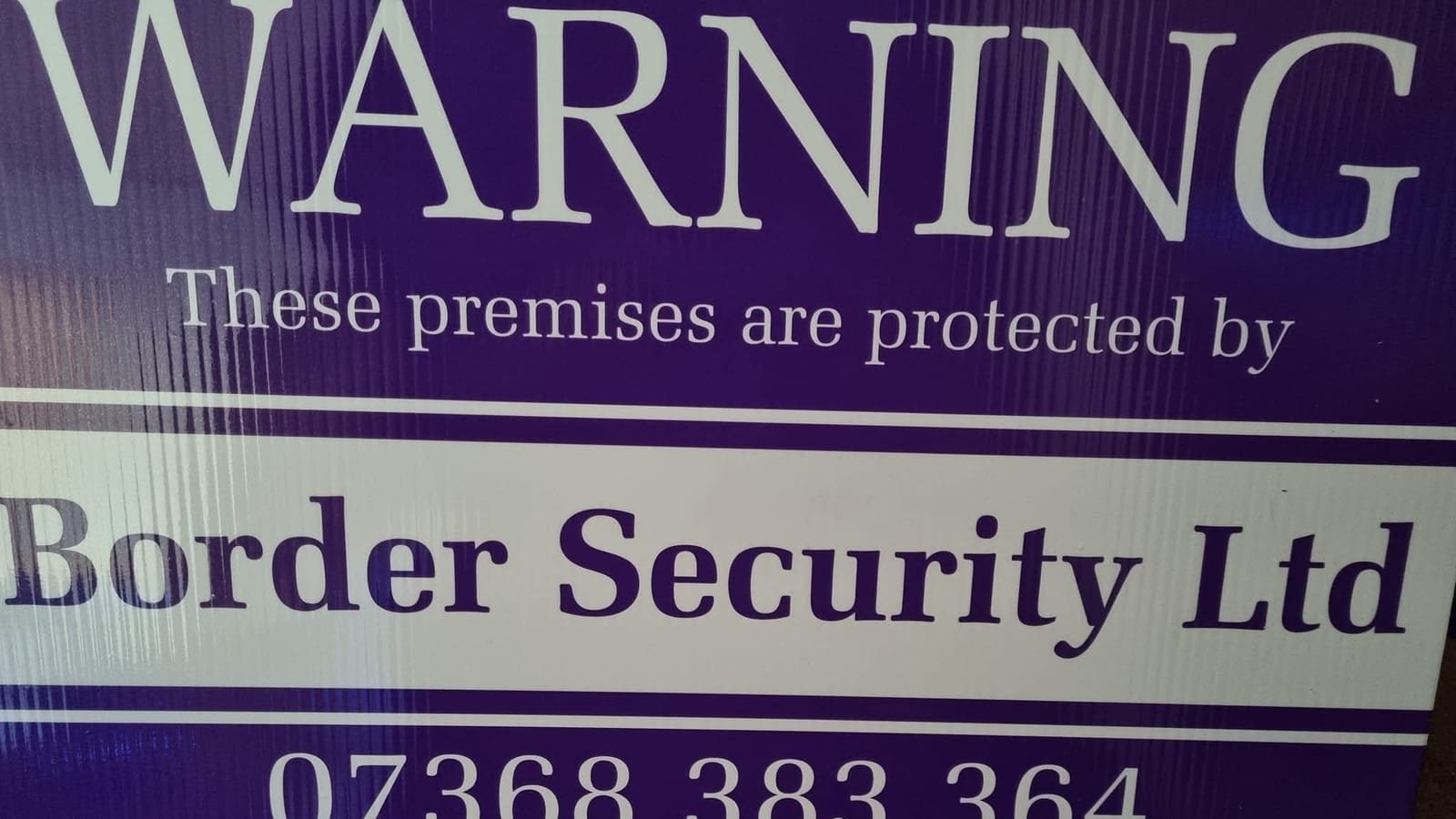 Border Security Ltd signage warning that premises are protected, Carlisle